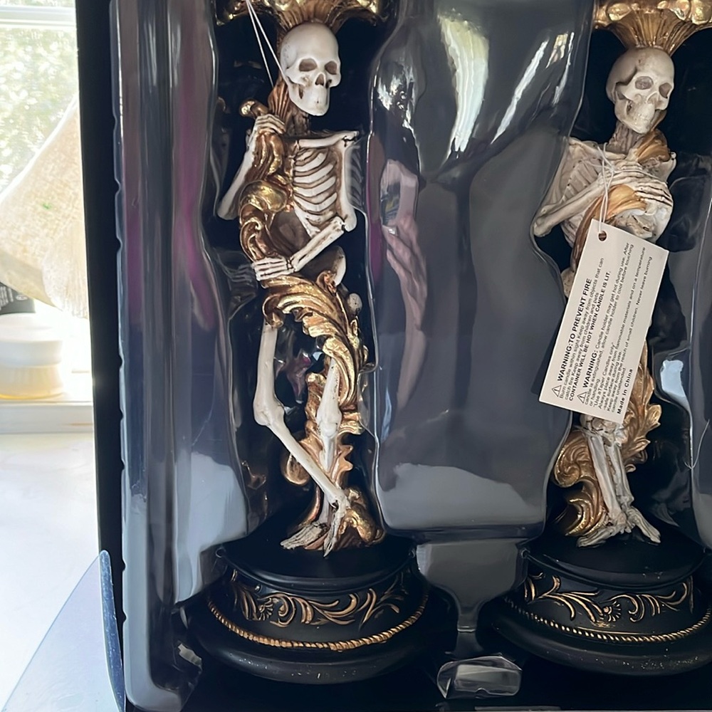 Christian Siriano candlesticks skeletons, new tags absolutely must for Halloween